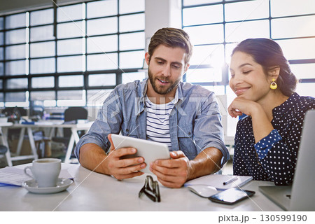 Tablet, man and woman reading email or social media for ideas in creative project in content marketing. Internet, planning collaboration for website and partnership at tech startup or design agency. Tablet, man and woman reading email or social media for ideas in creative project in content marketing. Internet, planning collaboration for website and partnership at tech startup or design agency. 130599190