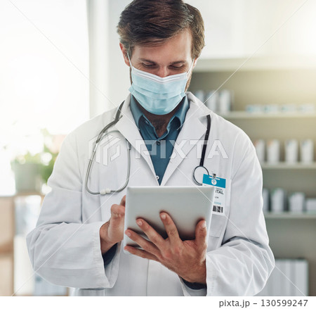 Healthcare, tablet and doctor with mask for medical care, wellness and research analysis in hospital. Covid, insurance and health worker on digital tech for internet, patient data and telehealth app Healthcare, tablet and doctor with mask for medical care, wellness and research analysis in hospital. Covid, insurance and health worker on digital tech for internet, patient data and telehealth app 130599247