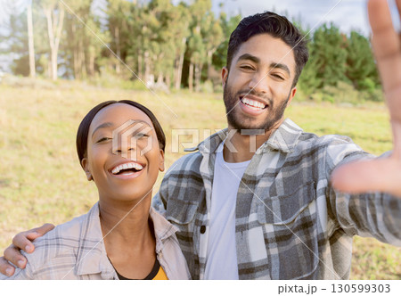 Portrait, interracial and couple in nature, love and happiness on vacation, romance and bonding. Romantic, black woman and happy man in countryside, holiday and adventure for quality time and loving Portrait, interracial and couple in nature, love and happiness on vacation, romance and bonding. Romantic, black woman and happy man in countryside, holiday and adventure for quality time and loving 130599303