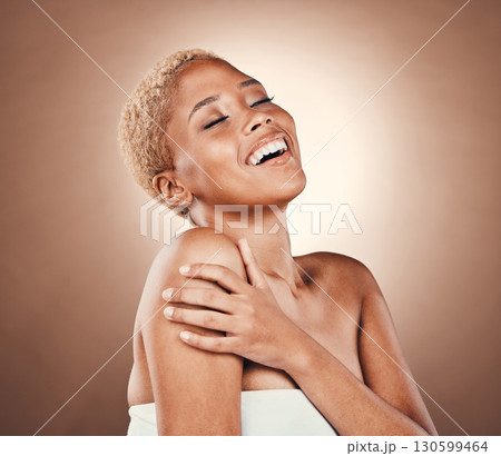 Black woman, beauty and skincare smile in studio on a brown background for dermatology. Aesthetic model person happy about cosmetics, self care and body glow with clean and healthy skin results Black woman, beauty and skincare smile in studio on a brown background for dermatology. Aesthetic model person happy about cosmetics, self care and body glow with clean and healthy skin results 130599464