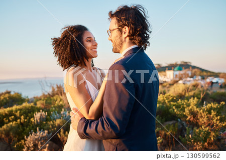 Love, happy and wedding with couple in nature for celebration, happiness and romance. Sunset, hug and affectionate with man and woman in embrace at countryside for ceremony, marriage and smile 130599562