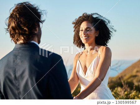 Wedding, smile and couple holding hands at beach in Hawaii on special day in summer. Love, romance and groom groom happy bride in luxury designer dress at outdoor marriage ceremony on tropical island Wedding, smile and couple holding hands at beach in Hawaii on special day in summer. Love, romance and groom groom happy bride in luxury designer dress at outdoor marriage ceremony on tropical island 130599567