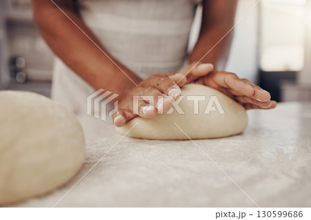 Man hands and dough press in kitchen for baking preparation work and process at culinary counter. Restaurant chef and worker in professional kitchen preparing wheat bread, cake or pizza recipe. Man hands and dough press in kitchen for baking preparation work and process at culinary counter. Restaurant chef and worker in professional kitchen preparing wheat bread, cake or pizza recipe. 130599686
