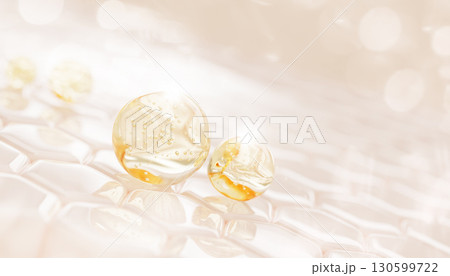 Facial skin cells with gold liquid gel serum, oil drops texture. Epidermis layer with hexagon pattern, yellow honey or retinol mask, collagen vitamin essence bubbles. Cosmetic care bg. 3D illustration 130599722