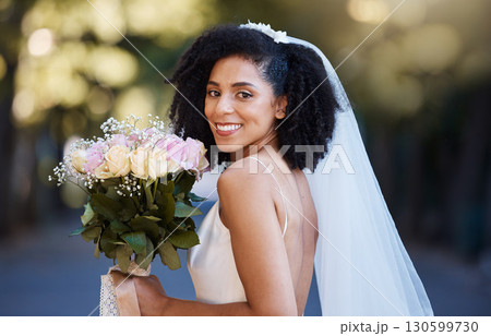 Bride, face and black woman with wedding and rose bouquet, happy in portrait with marriage and commitment outdoor. Event, celebration and happiness with smile in park married and Spring fashion Bride, face and black woman with wedding and rose bouquet, happy in portrait with marriage and commitment outdoor. Event, celebration and happiness with smile in park married and Spring fashion 130599730