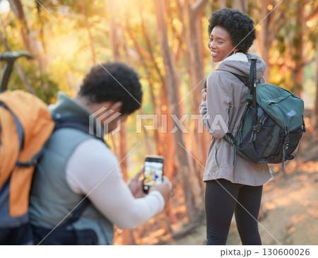 Forest, phone photography or black couple hiking in nature for exercise, workout or training on holiday. Travel, pictures or African partners trekking or walking to hill on a fun outdoor adventure Forest, phone photography or black couple hiking in nature for exercise, workout or training on holiday. Travel, pictures or African partners trekking or walking to hill on a fun outdoor adventure 130600026
