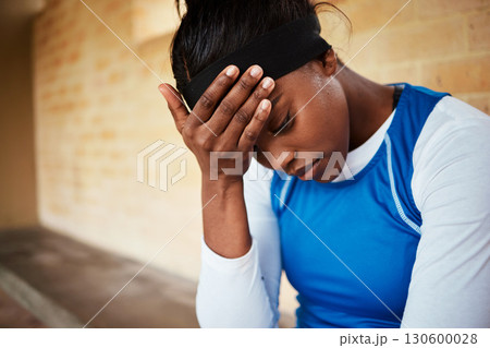 stress, headache and black woman with anxiety during fitness, routine or training against a brick wall background. Athletic, audition and girl with mental health issue, nervous and worried at stadium 130600028