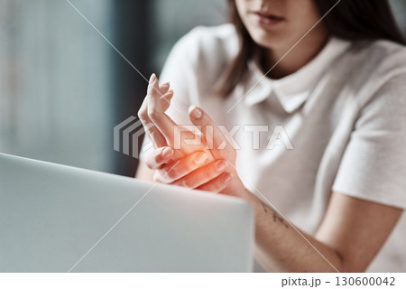 Laptop, pain in hand and woman in office with wrist injury from writing, typing and working on computer. Stress, medical care and girl worker touch hands with carpal tunnel, muscle ache and arthritis 130600042