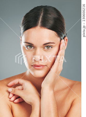 Skincare, portrait and woman touching face in studio for wellness, luxury facial and cosmetics. Young female model, aesthetic beauty and dermatology from healthy shine, natural glow and salon results Skincare, portrait and woman touching face in studio for wellness, luxury facial and cosmetics. Young female model, aesthetic beauty and dermatology from healthy shine, natural glow and salon results 130600216