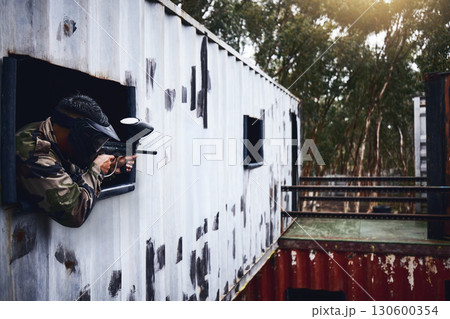 Paintball, gun or player in a shooting game with war action on a fun battlefield on holiday vacation. Military mission, fitness or man aiming with weapons gear for survival in an outdoor competition Paintball, gun or player in a shooting game with war action on a fun battlefield on holiday vacation. Military mission, fitness or man aiming with weapons gear for survival in an outdoor competition 130600354