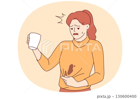 Clumsy woman spills coffee on sweater and needs urgent washing to prevent stain from drying 130600400