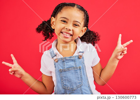 Happy, peace sign and portrait of girl smile on red background with trendy, stylish and cute summer outfit. Kids fashion, freedom and face of child with emoji, comic and meme hand gesture in studio Happy, peace sign and portrait of girl smile on red background with trendy, stylish and cute summer outfit. Kids fashion, freedom and face of child with emoji, comic and meme hand gesture in studio 130600773