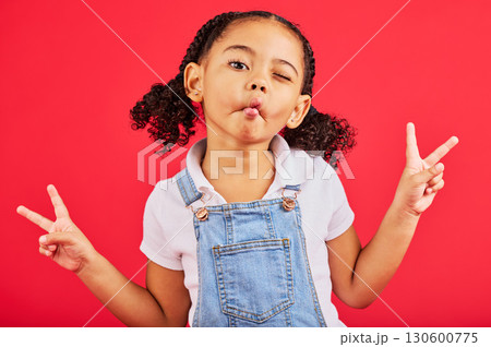 Happy, peace sign and kiss with portrait of girl for summer, happiness and funny face. Meme, fashion and smile with child and hand sign for youth, comedy and positive in red background studio Happy, peace sign and kiss with portrait of girl for summer, happiness and funny face. Meme, fashion and smile with child and hand sign for youth, comedy and positive in red background studio 130600775