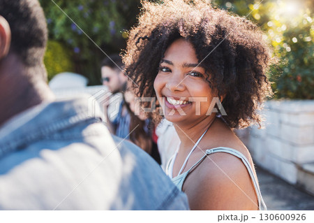 Happy, smile and portrait of a black woman at a party to relax with friends on a holiday in Miami. Summer, young and face of an African girl on vacation with a group of people for travel together 130600926