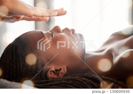 Black woman, relax and reiki spa treatment of a young female ready for facial. Skincare, beauty and salon wellness clinic with client feeling calm and zen from massage and holistic dermatology Black woman, relax and reiki spa treatment of a young female ready for facial. Skincare, beauty and salon wellness clinic with client feeling calm and zen from massage and holistic dermatology 130600930