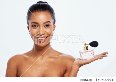 Black woman, luxury perfume and skincare portrait for beauty wellness and fragrance in white background studio. African model smile, salon product mockup and cosmetics parfum isolated for advertising Black woman, luxury perfume and skincare portrait for beauty wellness and fragrance in white background studio. African model smile, salon product mockup and cosmetics parfum isolated for advertising 130600994