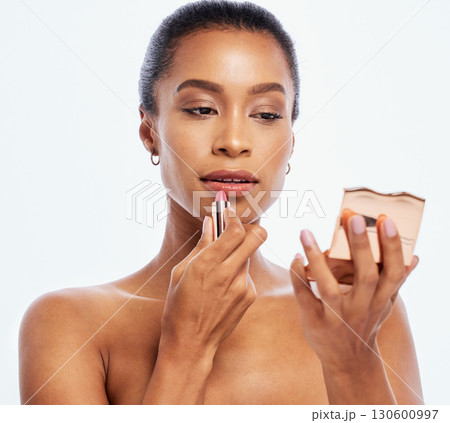 Lipstick, beauty and makeup by woman cosmetic product and mirror isolated in studio white background. Face, dermatology and model with elegant and smooth skin as self care or skincare routine Lipstick, beauty and makeup by woman cosmetic product and mirror isolated in studio white background. Face, dermatology and model with elegant and smooth skin as self care or skincare routine 130600997