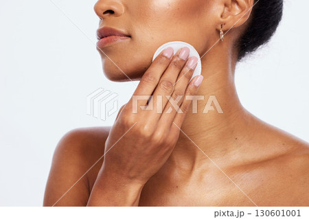 Cotton, skincare and beauty of woman, cleaning and salon cosmetics on studio background. Face, toner and makeup pad for dermatology, aesthetic wellness and facial product natural results of body glow Cotton, skincare and beauty of woman, cleaning and salon cosmetics on studio background. Face, toner and makeup pad for dermatology, aesthetic wellness and facial product natural results of body glow 130601001