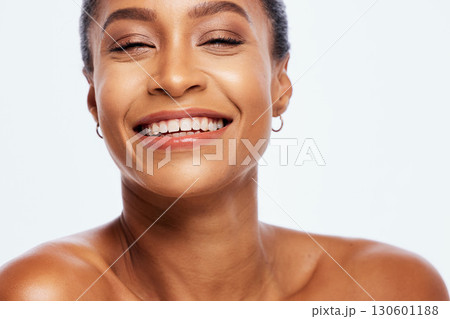 Portrait, beauty and teeth with a model black woman in studio isolated on a white background for oral hygiene. Face, skincare and dental with an attractive young female posing on blank space 130601188