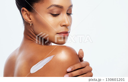 Skincare, beauty and back of a woman with cream for a body glow isolated on a white background. Collagen, cosmetics and spa model with sunscreen, lotion or dermatology creme on a studio backdrop Skincare, beauty and back of a woman with cream for a body glow isolated on a white background. Collagen, cosmetics and spa model with sunscreen, lotion or dermatology creme on a studio backdrop 130601201