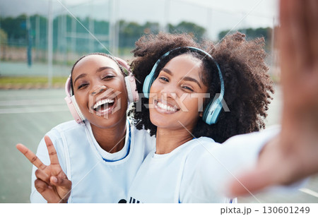 Friends, selfie and black women in portrait, netball and sports with team on court outdoor, smile and peace hand sign. Face, headphones and gen z with fitness, train for game and happy in picture Friends, selfie and black women in portrait, netball and sports with team on court outdoor, smile and peace hand sign. Face, headphones and gen z with fitness, train for game and happy in picture 130601249