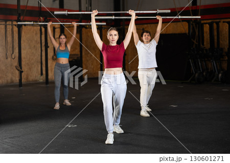 Woman in training with a barbell Woman in training with a barbell 130601271