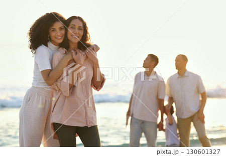 Hug, portrait and mother and daughter at the beach for vacation, family walk and bonding. Travel, love and elderly mom and woman hugging with affection while walking at the ocean in summer for peace Hug, portrait and mother and daughter at the beach for vacation, family walk and bonding. Travel, love and elderly mom and woman hugging with affection while walking at the ocean in summer for peace 130601327