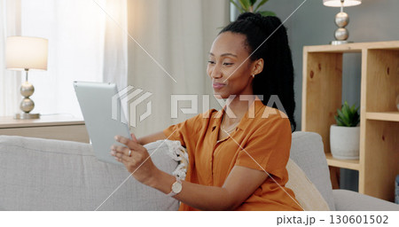 Video call, lounge and tablet with black woman in virtual meeting on sofa in home living room. Discussion, communication and smile with African female person and online conversation on app with chat 130601502