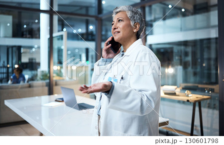 Night, woman and doctor with phone call, office and talking for planning, surgery schedule and consulting. Evening, happy mature female or medical professional with smartphone, healthcare or speaking Night, woman and doctor with phone call, office and talking for planning, surgery schedule and consulting. Evening, happy mature female or medical professional with smartphone, healthcare or speaking 130601798