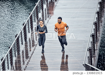 Top view, run or couple training, seaside or workout for wellness, healthy lifestyle or practice together. Running, black man or woman with exercise, promenade or performance with endurance or energy Top view, run or couple training, seaside or workout for wellness, healthy lifestyle or practice together. Running, black man or woman with exercise, promenade or performance with endurance or energy 130601915