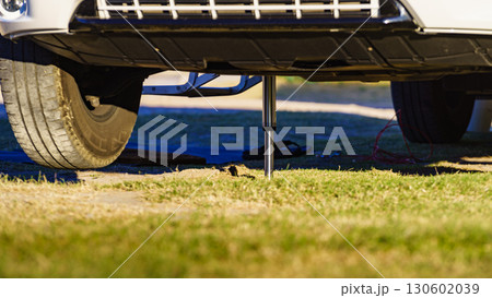 Camper leveling support leg in use. 130602039