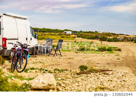 Campervan and bicycles camping on nature Campervan and bicycles camping on nature 130602044