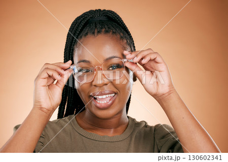 Black woman, portrait smile and glasses for fashion, style or smart casual against a studio background. Happy African American female model face smiling for eyewear, spectacles and sight or vision 130602341