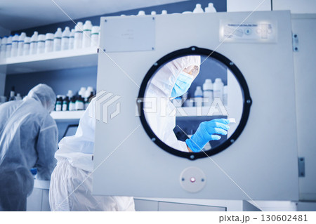 Science incubator, lab safety gear and biotechnology security for a medical research experiment. Virus analysis, pharmaceutical study and vaccine chemical innovation in laboratory with scientist team Science incubator, lab safety gear and biotechnology security for a medical research experiment. Virus analysis, pharmaceutical study and vaccine chemical innovation in laboratory with scientist team 130602481