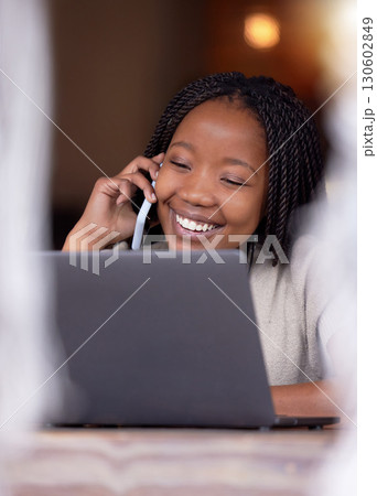 Black woman, phone call and smile on laptop in remote work for communication, conversation or discussion. Happy African American female freelancer smiling or talking on smartphone by computer at cafe Black woman, phone call and smile on laptop in remote work for communication, conversation or discussion. Happy African American female freelancer smiling or talking on smartphone by computer at cafe 130602849