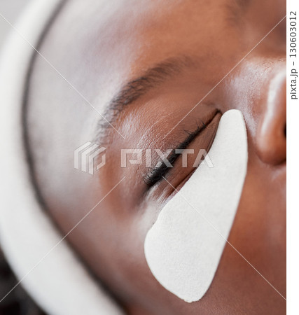 Beauty, spa and pad with eye of black woman for skincare, facial treatment and wellness. Health, peace and luxury with girl relax and face mask product for cosmetics, dermatology and hospitality Beauty, spa and pad with eye of black woman for skincare, facial treatment and wellness. Health, peace and luxury with girl relax and face mask product for cosmetics, dermatology and hospitality 130603012