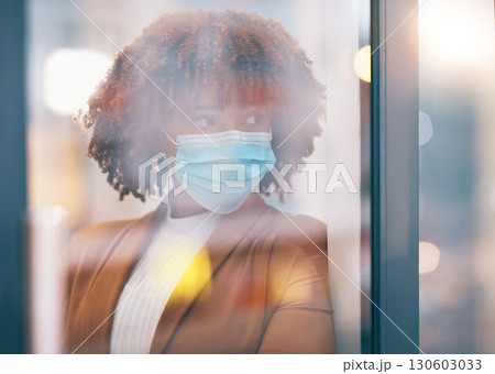 Covid, window and thinking with a business black woman in her office, standing by a glass pane alone. Idea, safety and mask with a female employee in her workplace during the corona virus pandemic Covid, window and thinking with a business black woman in her office, standing by a glass pane alone. Idea, safety and mask with a female employee in her workplace during the corona virus pandemic 130603033