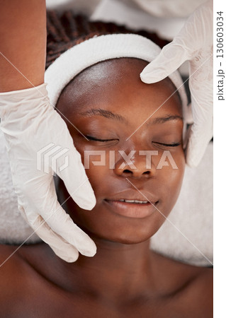 Spa woman, hands and face massage for beauty healthcare, cosmetics facial treatment or salon wellness. Luxury health service, top view and relax African client, customer or patient for medical care Spa woman, hands and face massage for beauty healthcare, cosmetics facial treatment or salon wellness. Luxury health service, top view and relax African client, customer or patient for medical care 130603034