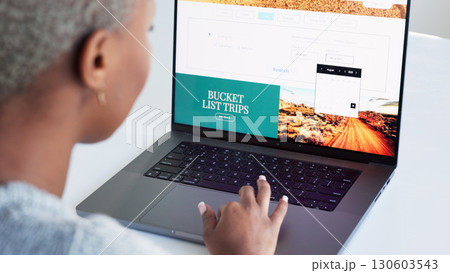 Laptop, hand and bucket list with a woman on the search online for an idea for a trip, holiday or vacation. Website, thinking and planning with a female looking on the internet for an adventure Laptop, hand and bucket list with a woman on the search online for an idea for a trip, holiday or vacation. Website, thinking and planning with a female looking on the internet for an adventure 130603543