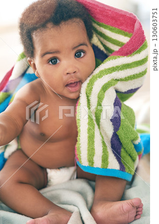 African baby, girl and sitting for portrait with blanket, young or healthy in bedroom at family home. Infant black person, bed and towel for growth, development or health in morning sunshine at house African baby, girl and sitting for portrait with blanket, young or healthy in bedroom at family home. Infant black person, bed and towel for growth, development or health in morning sunshine at house 130603751