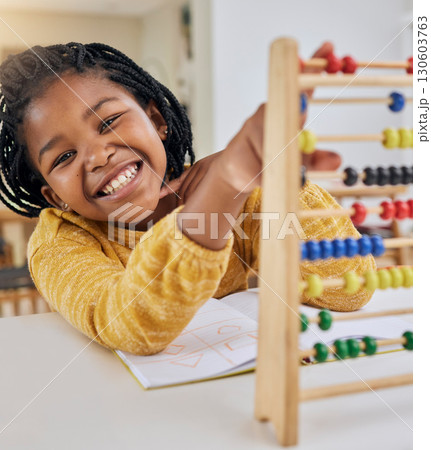 Abacus, kid learning and portrait of a girl in a house with study paper and math homework. Happiness, school work and young child with a smile from knowledge development and numbers at a house desk 130603763