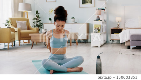 Fitness, yoga and woman stretching in exercise, zen workout or meditation on living room floor at home. Female person or yogi in warm up training, spiritual wellness or healthy body on mat in house 130603853