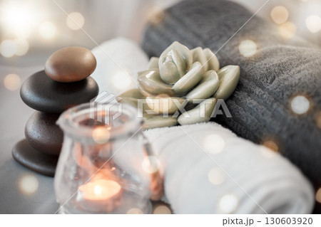 Rock, candle and towel in a spa for zen to relax in a stress free empty room with aromatherapy ambience. Luxury, salon and wellness with still life objects in an interior for relaxing stress relief Rock, candle and towel in a spa for zen to relax in a stress free empty room with aromatherapy ambience. Luxury, salon and wellness with still life objects in an interior for relaxing stress relief 130603920