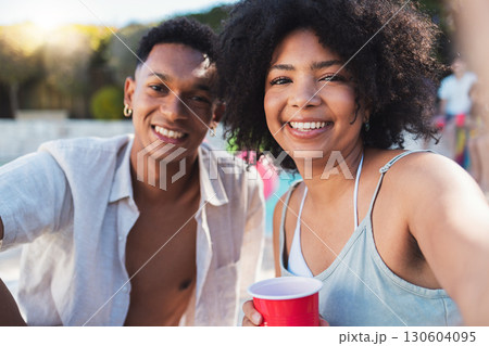 Selfie, party and summer with a black couple having fun outdoor while drinking at a celebration event. Love, alcohol and portrait with a young man and woman outside together at a birthday or social Selfie, party and summer with a black couple having fun outdoor while drinking at a celebration event. Love, alcohol and portrait with a young man and woman outside together at a birthday or social 130604095