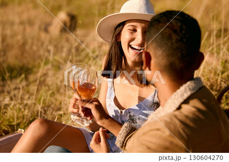 Couple with wine, outdoor picnic and happiness, romantic date with alcohol and commitment with adventure. Travel, man and woman with happy people, love and care with cheers, holiday and romance 130604270