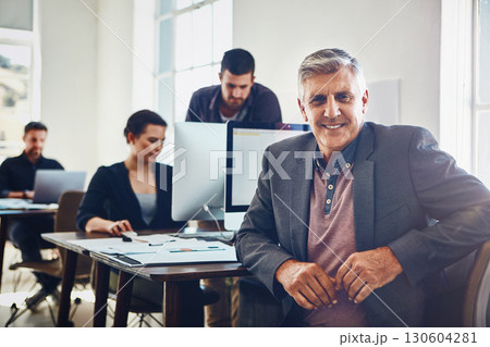 Senior, portrait and business man in office or company workplace. Leadership, ceo and happy elderly male employee or manager with colleagues working on marketing report, advertising or sales project. 130604281