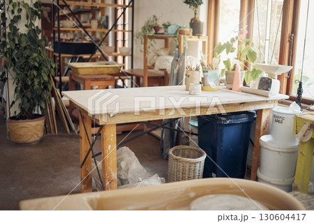 Creative, art and pottery with empty room of workshop for design, manufacturing and small business. Ceramics, interior and production with table in studio of for painting, inspiration and retail Creative, art and pottery with empty room of workshop for design, manufacturing and small business. Ceramics, interior and production with table in studio of for painting, inspiration and retail 130604417