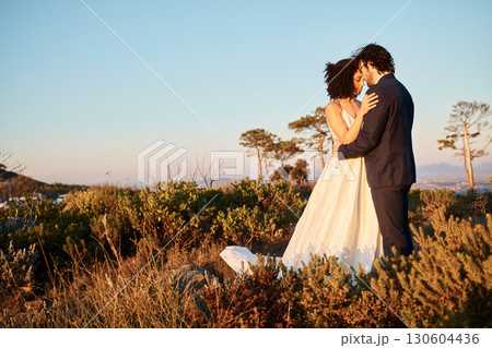 Intimate, wedding couple and hug in nature with mock up of marriage celebration in Africa outdoor. Commitment, save the date and love with bride, man and calm embrace with blue sky together in union Intimate, wedding couple and hug in nature with mock up of marriage celebration in Africa outdoor. Commitment, save the date and love with bride, man and calm embrace with blue sky together in union 130604436