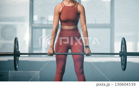 Gym body, barbell exercise and woman doing muscle fitness performance for health, strength training or bodybuilding. Strong arm workout, athlete wellness lifestyle and bodybuilder girl weightlifting 130604539