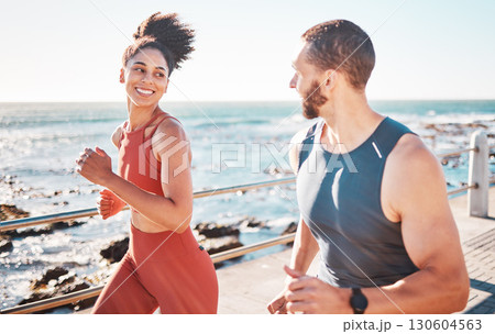 Running, fitness and exercise with a sports couple outdoor in summer for cardio or endurance by the ocean. Health, training and sea with a man and woman runner on a promenade for a workout together 130604563